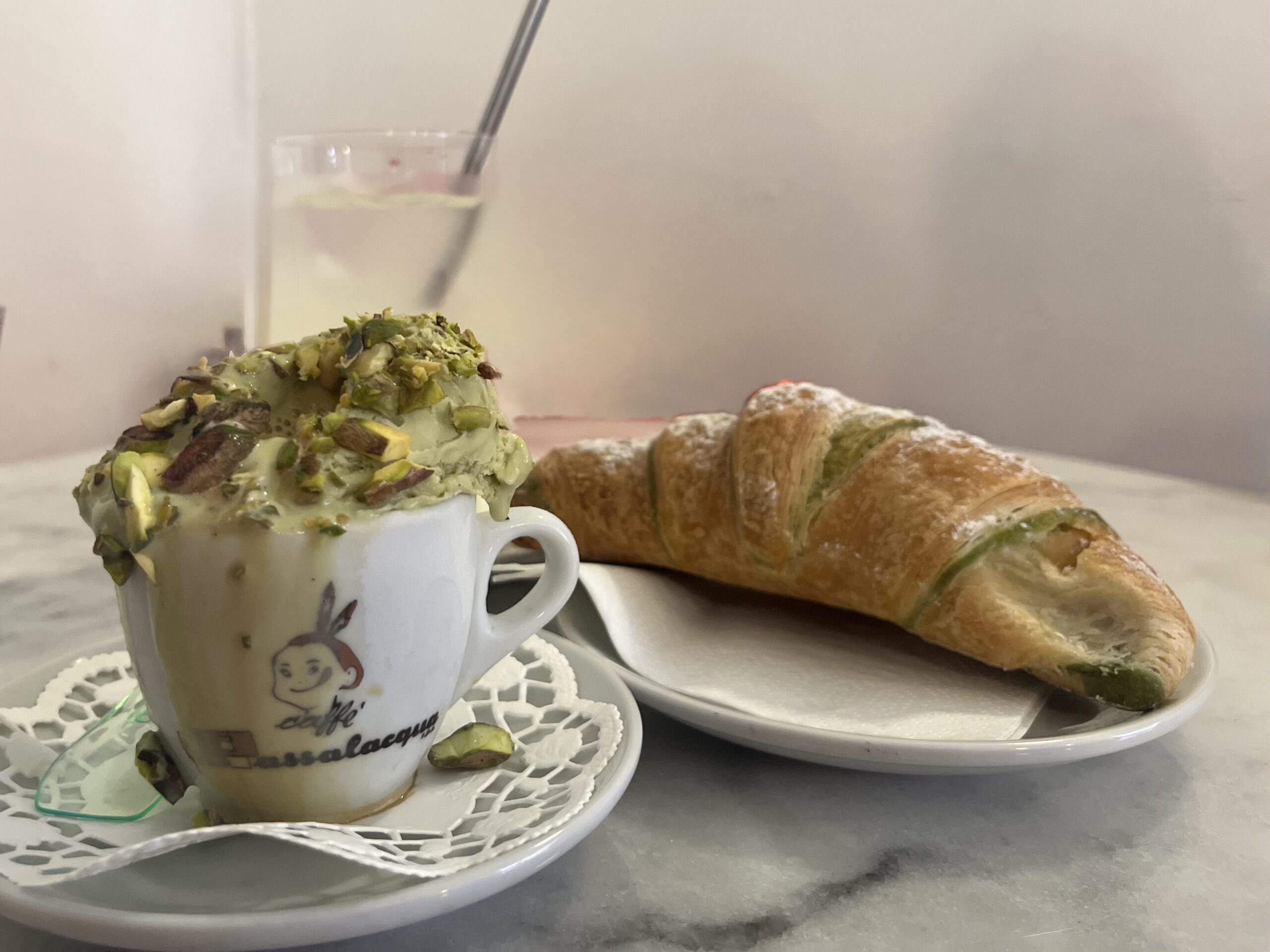 image shows coffee and croissant at a Stockholm cafe