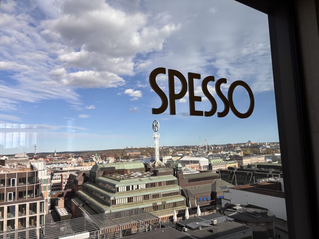 Image shows rooftop bar Spesso and the view over the rooftops of Stockholm